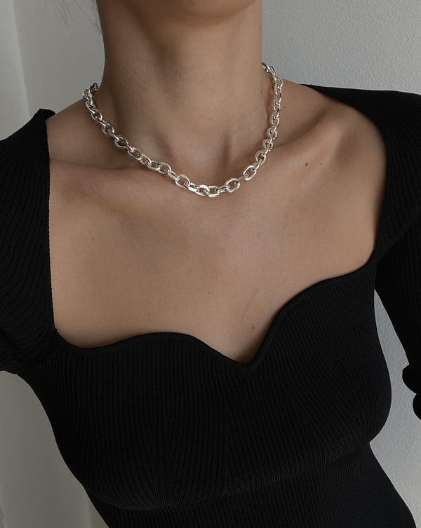 black dress silver necklace 